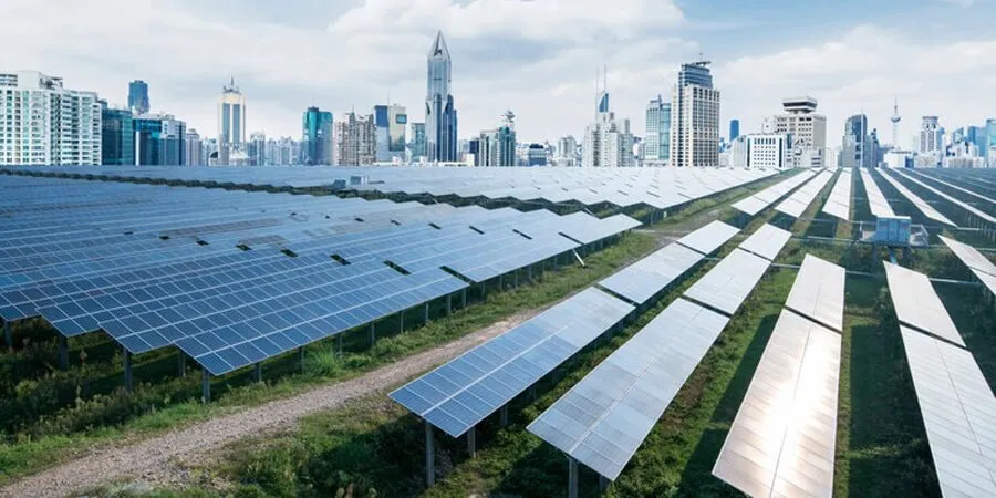 Solar farm with city skyline