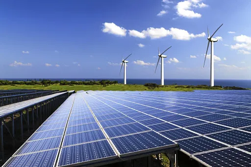 Solar panels and wind turbine by water